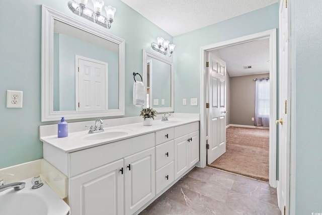 127 Ashworth Dr, Little River, SC 29566 - bathroom with a textured ceiling, double vanity, a garden tub, and marble finish floors