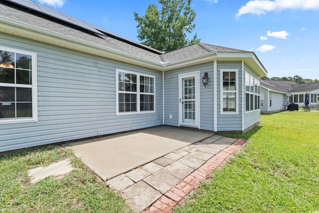 127 Ashworth Dr, Little River, SC 29566 - back of house featuring a patio area, a lawn, and a shingled roof