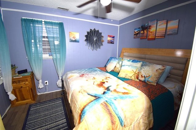 6001-5723 Kings Hwy, Myrtle Beach, SC 29575 - bedroom with wood finished floors, a ceiling fan, and a textured ceiling