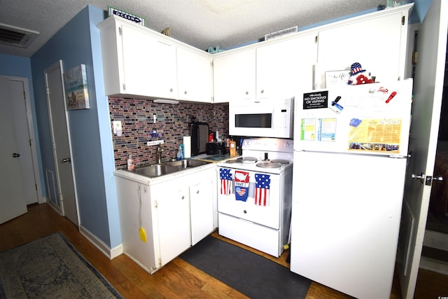 6001-5723 Kings Hwy, Myrtle Beach, SC 29575 - kitchen featuring white appliances, backsplash, dark wood finished floors, light countertops, and white cabinetry