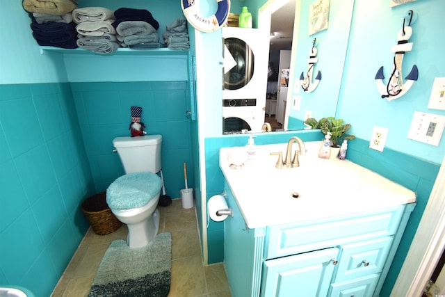 6001-5723 Kings Hwy, Myrtle Beach, SC 29575 - bathroom with stacked washing machine and dryer, vanity, and tile patterned floors