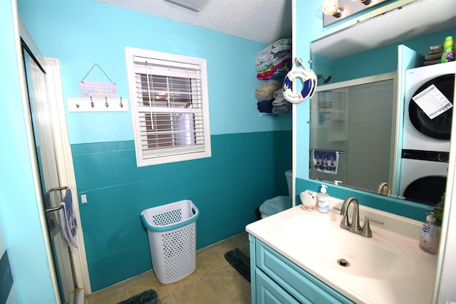 6001-5723 Kings Hwy, Myrtle Beach, SC 29575 - full bath featuring a shower stall, vanity, tile patterned floors, wainscoting, and tile walls