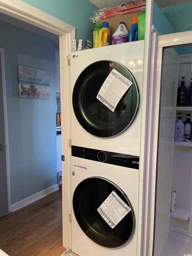 6001-5723 Kings Hwy, Myrtle Beach, SC 29575 - laundry room featuring estacked washer and dryer and wood finished floors