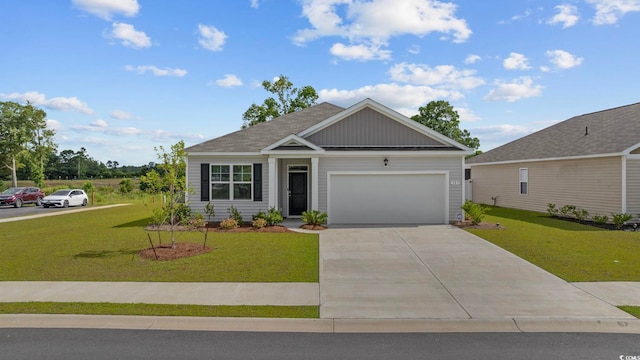 305 Picnic Basket Pl, Longs, SC 29568 - view of front facade with a front yard, a garage, and driveway
