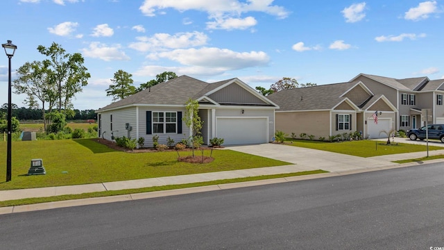 305 Picnic Basket Pl, Longs, SC 29568 - view of front facade featuring concrete driveway, an attached garage, and a front yard