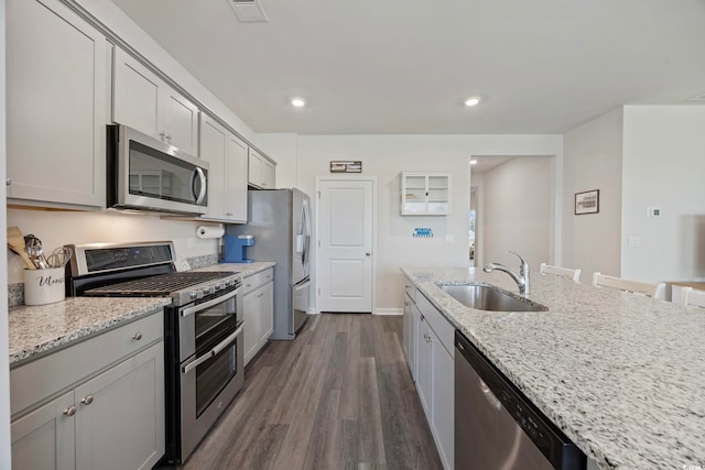 305 Picnic Basket Pl, Longs, SC 29568 - kitchen featuring stainless steel appliances, dark wood-style floors, light stone countertops, recessed lighting, and gray cabinets