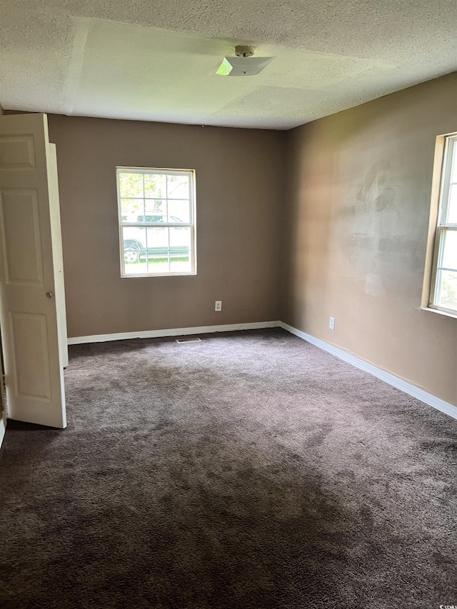1706 Foster St, Conway, SC 29527 - unfurnished room with a textured ceiling and dark carpet