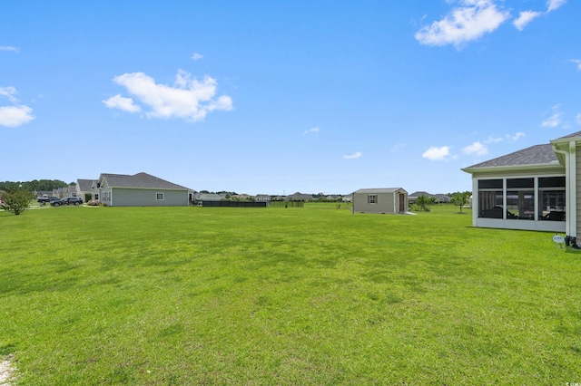215 Vineyard Lake Cir, Conway, SC 29527 - view of green lawn featuring a sunroom and an outbuilding