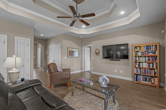 215 Vineyard Lake Cir, Conway, SC 29527 - living room with ornamental molding, arched walkways, ceiling fan, a raised ceiling, and wood finished floors