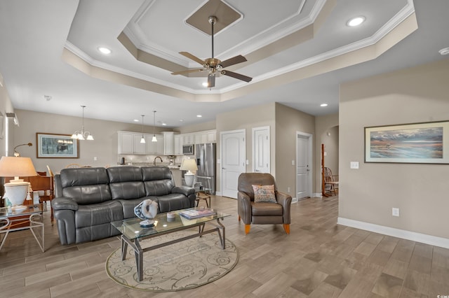 215 Vineyard Lake Cir, Conway, SC 29527 - living area with crown molding, a tray ceiling, ceiling fan, recessed lighting, and light wood-style floors