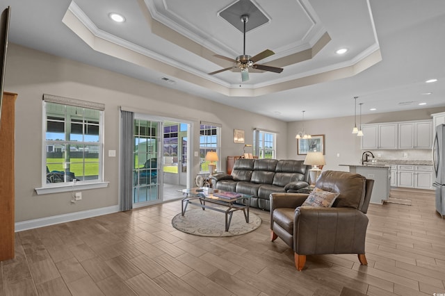 215 Vineyard Lake Cir, Conway, SC 29527 - living room featuring crown molding, ceiling fan, healthy amount of natural light, a raised ceiling, and recessed lighting