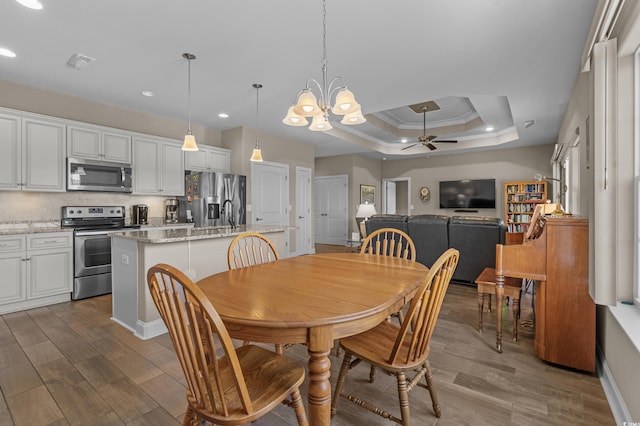 215 Vineyard Lake Cir, Conway, SC 29527 - dining room featuring ceiling fan, recessed lighting, a chandelier, dark wood-type flooring, and a raised ceiling
