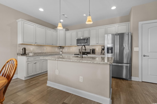 215 Vineyard Lake Cir, Conway, SC 29527 - kitchen featuring appliances with stainless steel finishes, dark wood-style floors, hanging light fixtures, backsplash, and recessed lighting