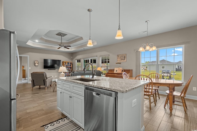 215 Vineyard Lake Cir, Conway, SC 29527 - kitchen with appliances with stainless steel finishes, open floor plan, light wood-type flooring, white cabinets, and light stone countertops