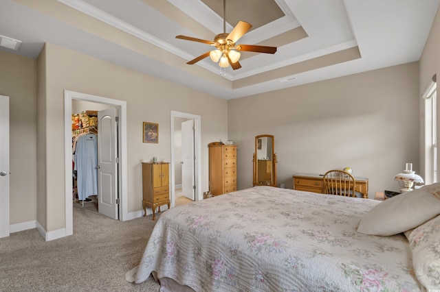 215 Vineyard Lake Cir, Conway, SC 29527 - carpeted bedroom featuring a raised ceiling, a walk in closet, crown molding, a ceiling fan, and ensuite bathroom