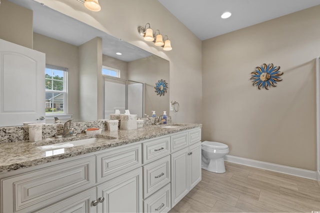 215 Vineyard Lake Cir, Conway, SC 29527 - full bathroom featuring double vanity, a shower with shower door, and recessed lighting