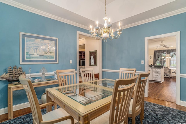 285 Georgetown Dr, Pawleys Island, SC 29585 - dining space with a chandelier, wood finished floors, and crown molding