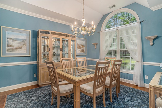 285 Georgetown Dr, Pawleys Island, SC 29585 - dining area with a chandelier, lofted ceiling, and wood finished floors