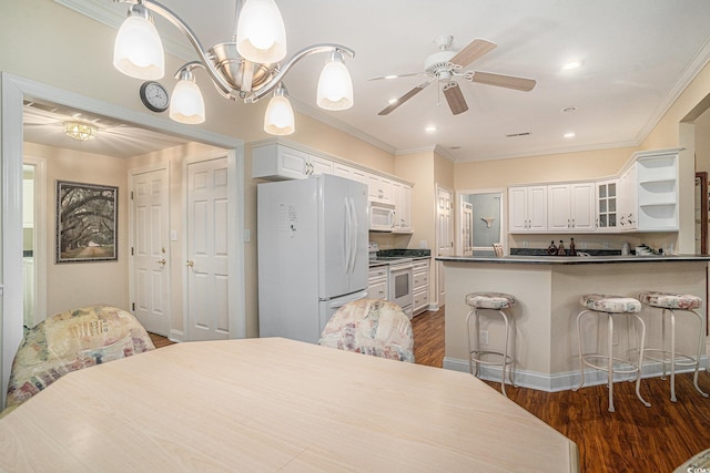 285 Georgetown Dr, Pawleys Island, SC 29585 - bedroom featuring freestanding refrigerator, dark wood finished floors, crown molding, a ceiling fan, and recessed lighting