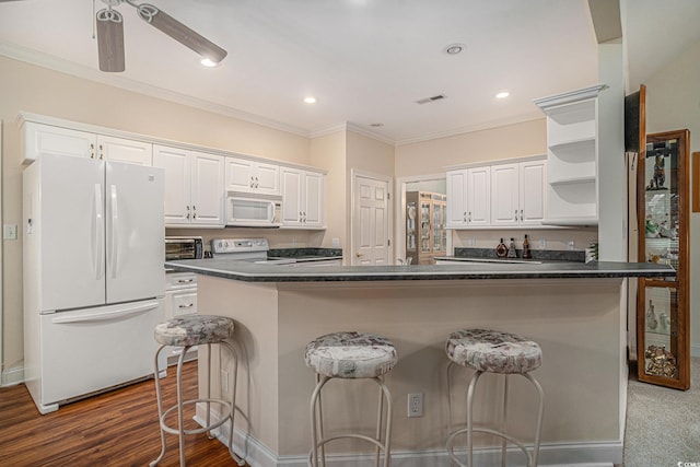 285 Georgetown Dr, Pawleys Island, SC 29585 - kitchen with white appliances, open shelves, dark countertops, crown molding, and white cabinetry