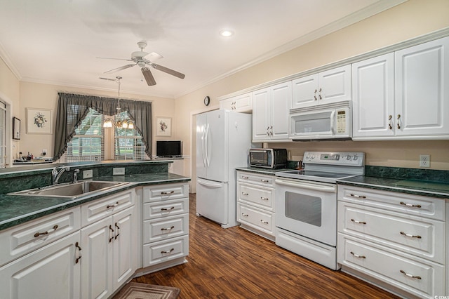 285 Georgetown Dr, Pawleys Island, SC 29585 - kitchen featuring white appliances, dark countertops, ceiling fan, dark wood finished floors, and crown molding
