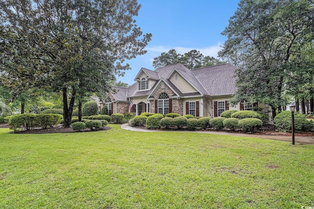 285 Georgetown Dr, Pawleys Island, SC 29585 - view of front facade with a front yard