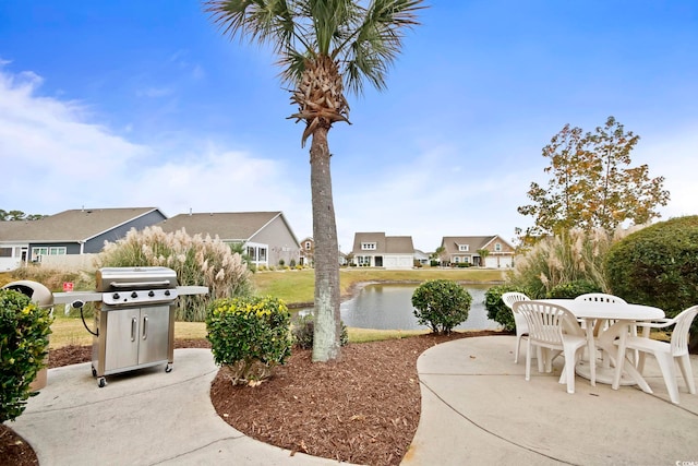 4179 Hibiscus Dr Unit 12-301, Little River, SC 29566 - view of patio / terrace featuring area for grilling, a residential view, outdoor dining area, and a water view