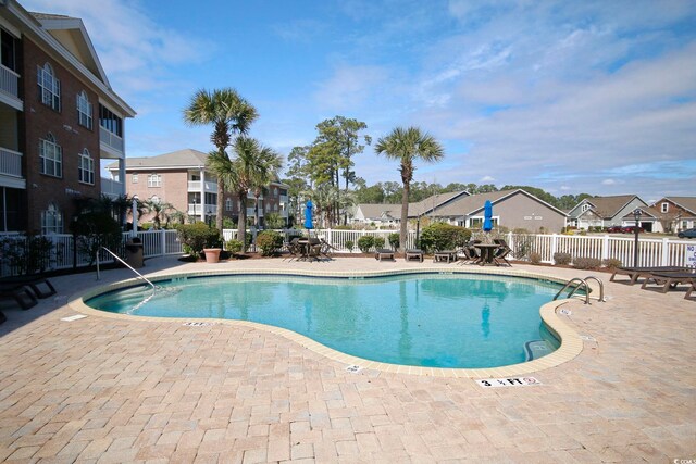 4179 Hibiscus Dr Unit 12-301, Little River, SC 29566 - community pool with a residential view and a patio area