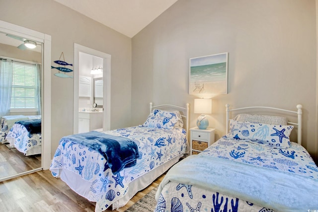 4179 Hibiscus Dr Unit 12-301, Little River, SC 29566 - bedroom with wood finished floors, lofted ceiling, and connected bathroom