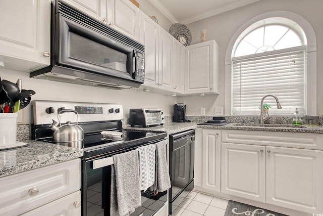 4179 Hibiscus Dr Unit 12-301, Little River, SC 29566 - kitchen featuring black appliances, crown molding, white cabinets, light tile patterned flooring, and light stone counters