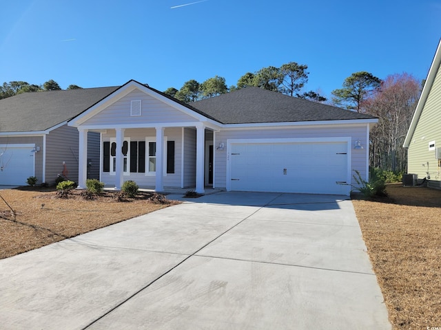 201 Augusta Green Way, Myrtle Beach, SC 29579 - ranch-style home featuring concrete driveway, a porch, an attached garage, and roof with shingles