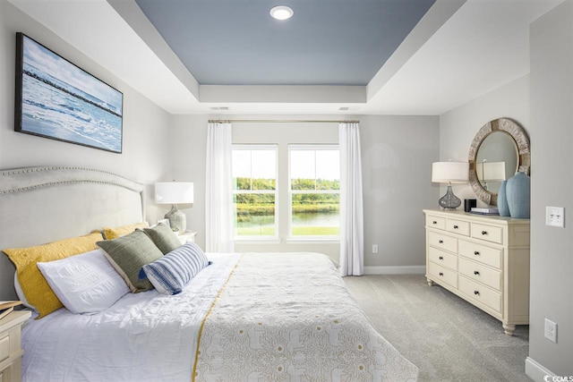 201 Augusta Green Way, Myrtle Beach, SC 29579 - bedroom featuring a raised ceiling, light carpet, and a water view