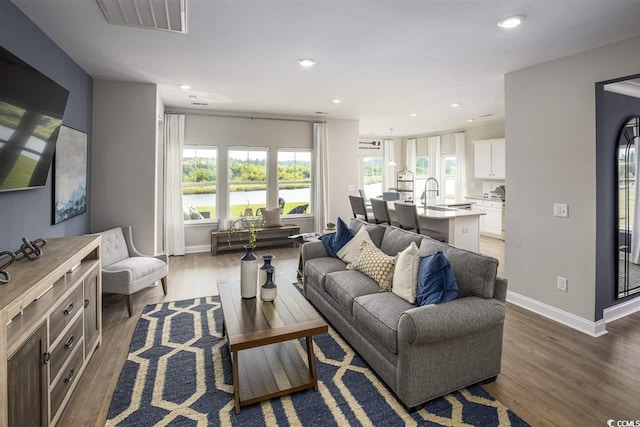 201 Augusta Green Way, Myrtle Beach, SC 29579 - living room with wood finished floors, plenty of natural light, and recessed lighting