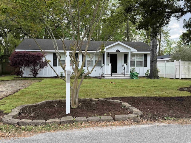 727 5th Ave S, Surfside Beach, SC 29575 - ranch-style house featuring covered porch, board and batten siding, and a shingled roof