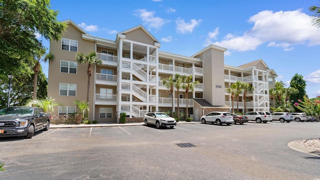 4366 Rivergate Ln Unit 404, Little River, SC 29566 - view of apartment building / complex featuring uncovered parking
