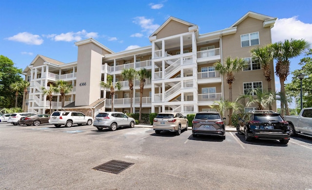 4366 Rivergate Ln Unit 404, Little River, SC 29566 - view of apartment building / complex with uncovered parking