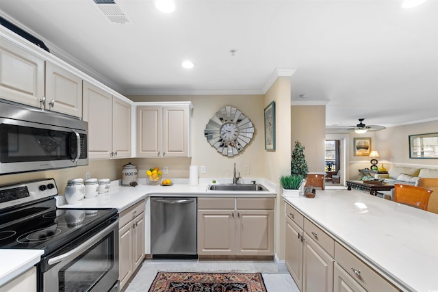 4366 Rivergate Ln Unit 404, Little River, SC 29566 - kitchen with stainless steel appliances, crown molding, light countertops, ceiling fan, and recessed lighting