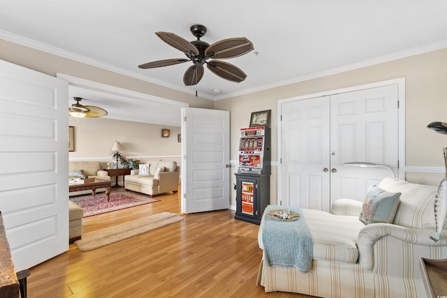 4366 Rivergate Ln Unit 404, Little River, SC 29566 - bedroom with light wood-type flooring, crown molding, a closet, and a ceiling fan