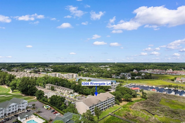 4366 Rivergate Ln Unit 404, Little River, SC 29566 - bird's eye view of a tree filled landscape and a golf club