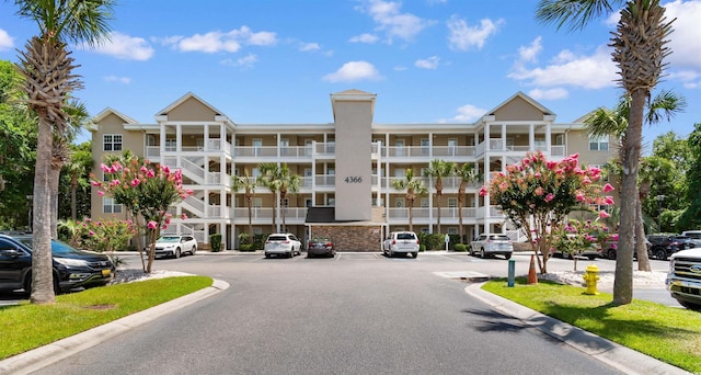 4366 Rivergate Ln Unit 404, Little River, SC 29566 - view of apartment building / complex with uncovered parking