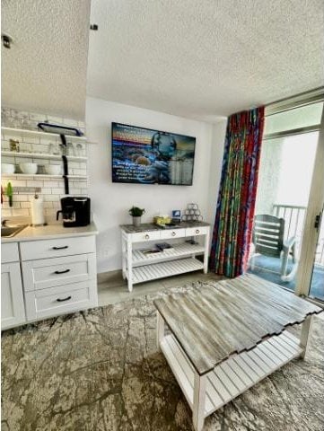 158 Sea Watch Dr Unit 707, Myrtle Beach, SC 29572 - living room with a textured ceiling
