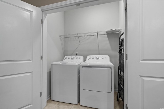 4737 Seclusion Ln, Myrtle Beach, SC 29577 - washroom with washer and clothes dryer and light tile patterned floors