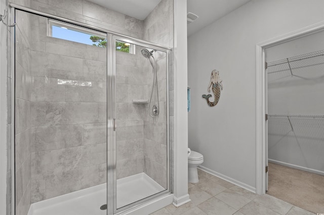 4737 Seclusion Ln, Myrtle Beach, SC 29577 - full bathroom featuring a stall shower, a walk in closet, and tile patterned flooring