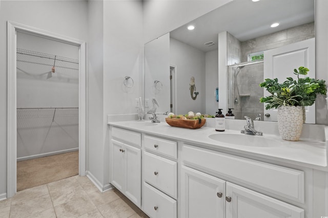 4737 Seclusion Ln, Myrtle Beach, SC 29577 - full bathroom with double vanity, a shower stall, and a walk in closet
