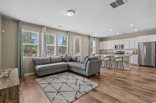 4737 Seclusion Ln, Myrtle Beach, SC 29577 - living area with light wood-style flooring and recessed lighting