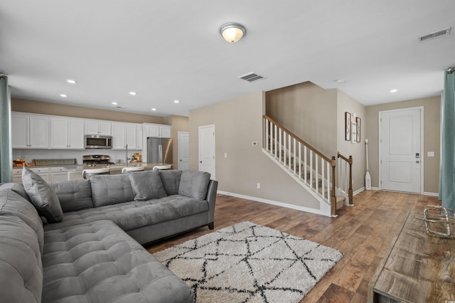 4737 Seclusion Ln, Myrtle Beach, SC 29577 - living area with stairway, hardwood / wood-style flooring, and recessed lighting