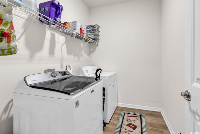 325 Cardita Loop, Myrtle Beach, SC 29588 - laundry room featuring washing machine and dryer and light wood-type flooring