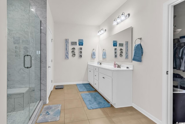 325 Cardita Loop, Myrtle Beach, SC 29588 - full bath featuring double vanity, a walk in closet, a stall shower, and tile patterned floors