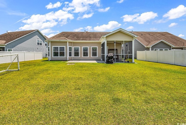 325 Cardita Loop, Myrtle Beach, SC 29588 - rear view of property featuring a fenced backyard, a sunroom, and a patio