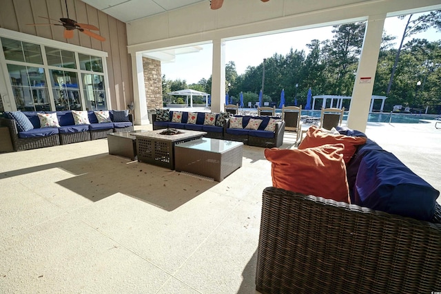 530 Inverarry St, Murrells Inlet, SC 29576 - view of patio / terrace with a ceiling fan, an outdoor living space with a fire pit, and a community pool